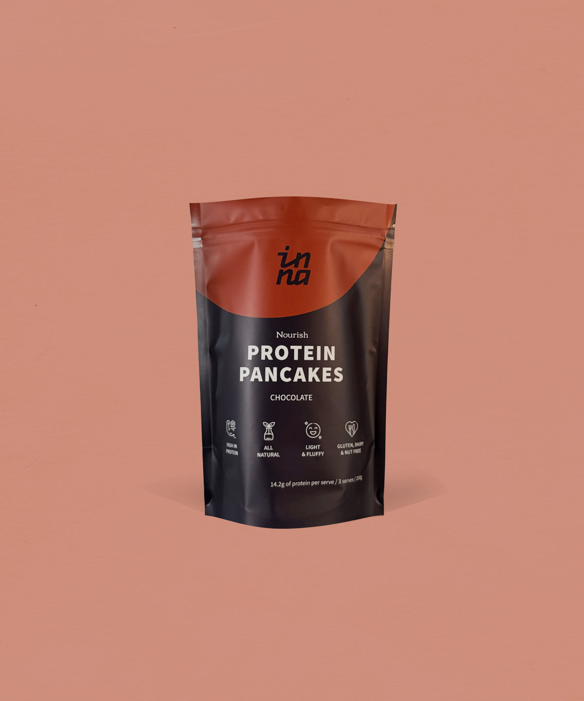A stand-up pouch of Inna Protein Pancakes in Chocolate flavour, set against a solid terracotta background.