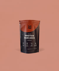 A stand-up pouch of Inna Protein Pancakes in Chocolate flavour, set against a solid terracotta background.