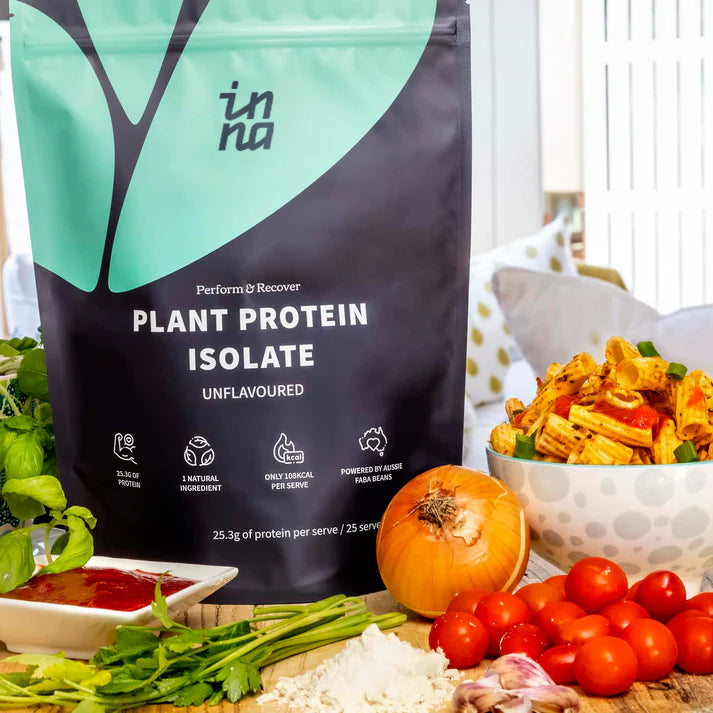 Bag of Inna Protein plant protein isolate with vegetables on a table